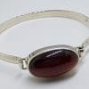 Sterling Silver Heavy Bangle with Oval Cabochon Garnet