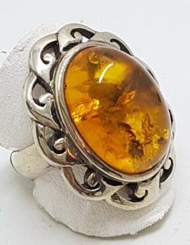 Sterling Silver Large Oval Natural Amber Ring with Twist Design