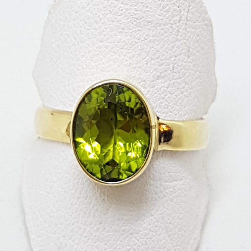 20200422_190954 9ct Yellow Gold Peridot Oval Bezel Set Ring