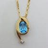 9ct Yellow Gold Oval Topaz & Diamond Curved Pendant on Gold Chain