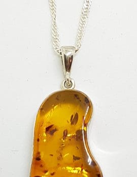 Sterling Silver Natural Amber Odd Shape Pendant on Silver Chain