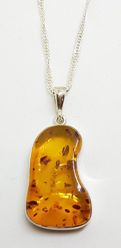 Sterling Silver Natural Amber Odd Shape Pendant on Silver Chain
