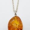 Sterling Silver Natural Amber Carved Pendant on Silver Chain