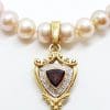 9ct Gold Shield Shape Garnet surrounded by Diamonds Enhancer Pendant on Pearl Necklace