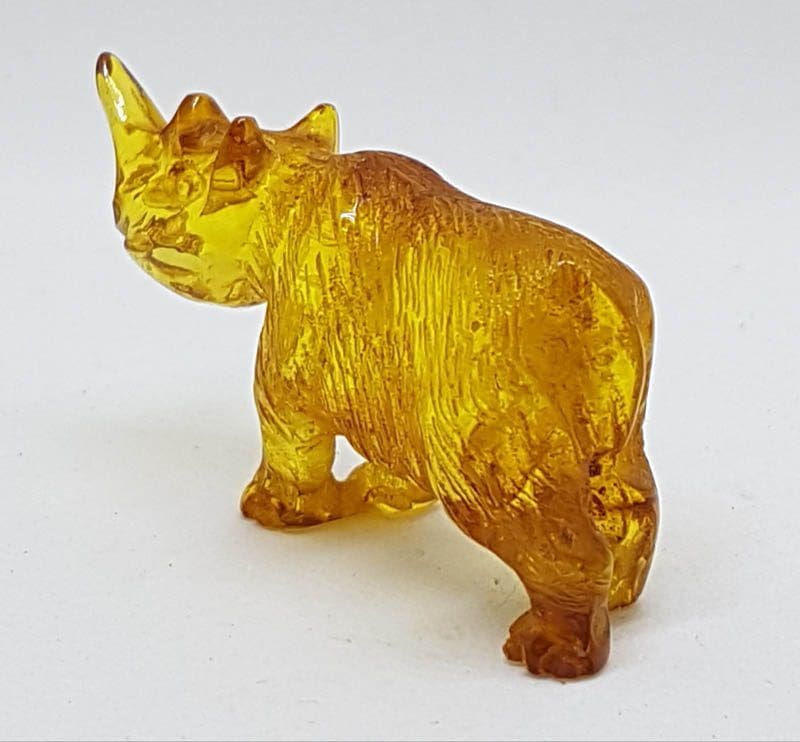 20200730_141020 (1) Hand Carved Natural Baltic Amber Small Rhinoceros Figurine / Statue