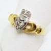 18ct Yellow and White Gold Irish Claddagh Ring set with a .25ct Heart Shaped Diamond Plus 2 Diamonds set into the Crown