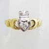 18ct Yellow and White Gold Irish Claddagh Ring set with a .25ct Heart Shaped Diamond Plus 2 Diamonds set into the Crown