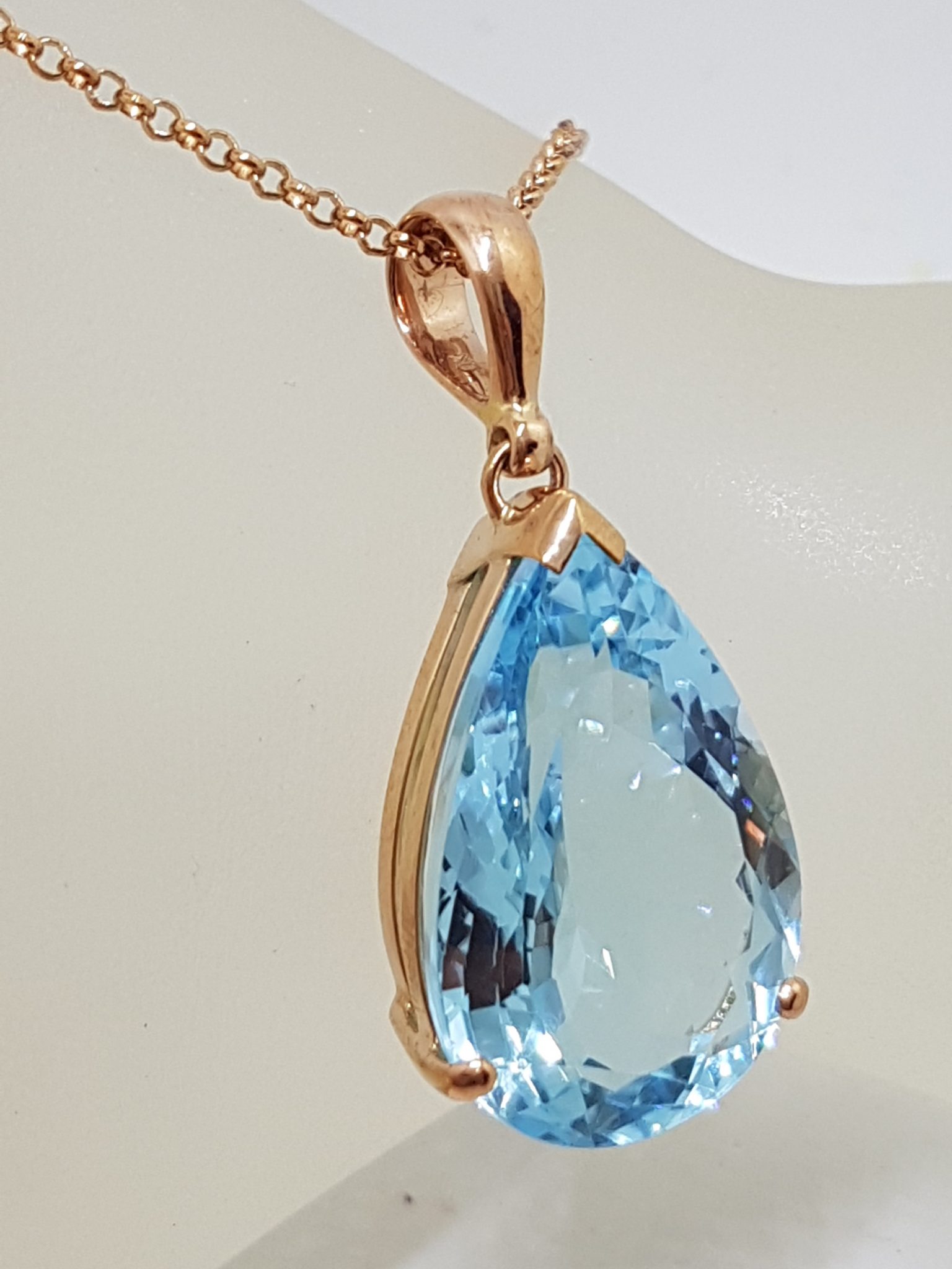 9ct Rose Gold Large Teardrop Shape Blue Topaz Pendant on 9ct Chain