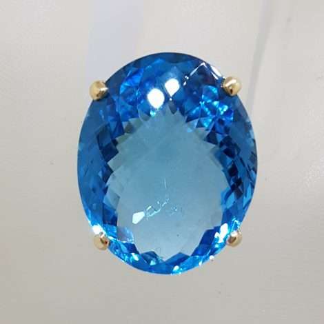 9ct Yellow Gold Large Oval Deep Blue Cushion Cut Topaz Claw Set Cocktail Ring