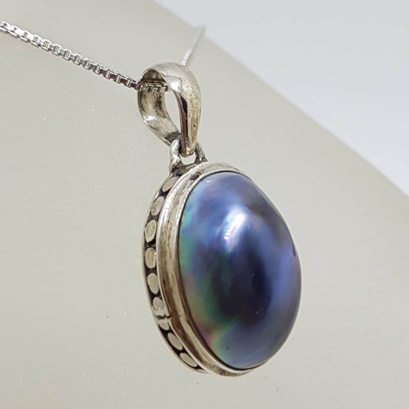 20201026_213641 Sterling Silver Blue / Black Oval Mabe Pearl Pendant on Silver Chain