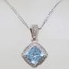9ct White Gold Square Topaz Surrounded by Diamond Cluster Pendant on Gold Chain