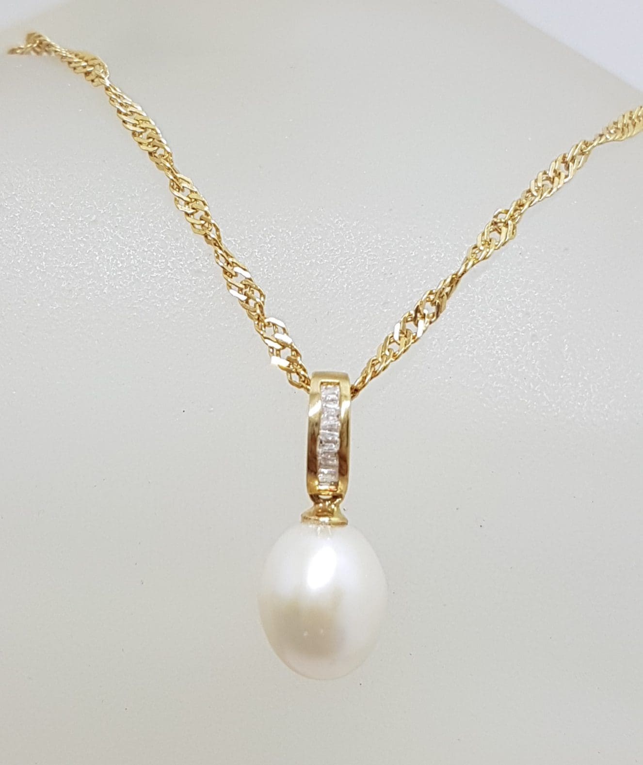 7899ct Yellow Gold Pearl & Channel Set Diamond Pendant on Gold Chain