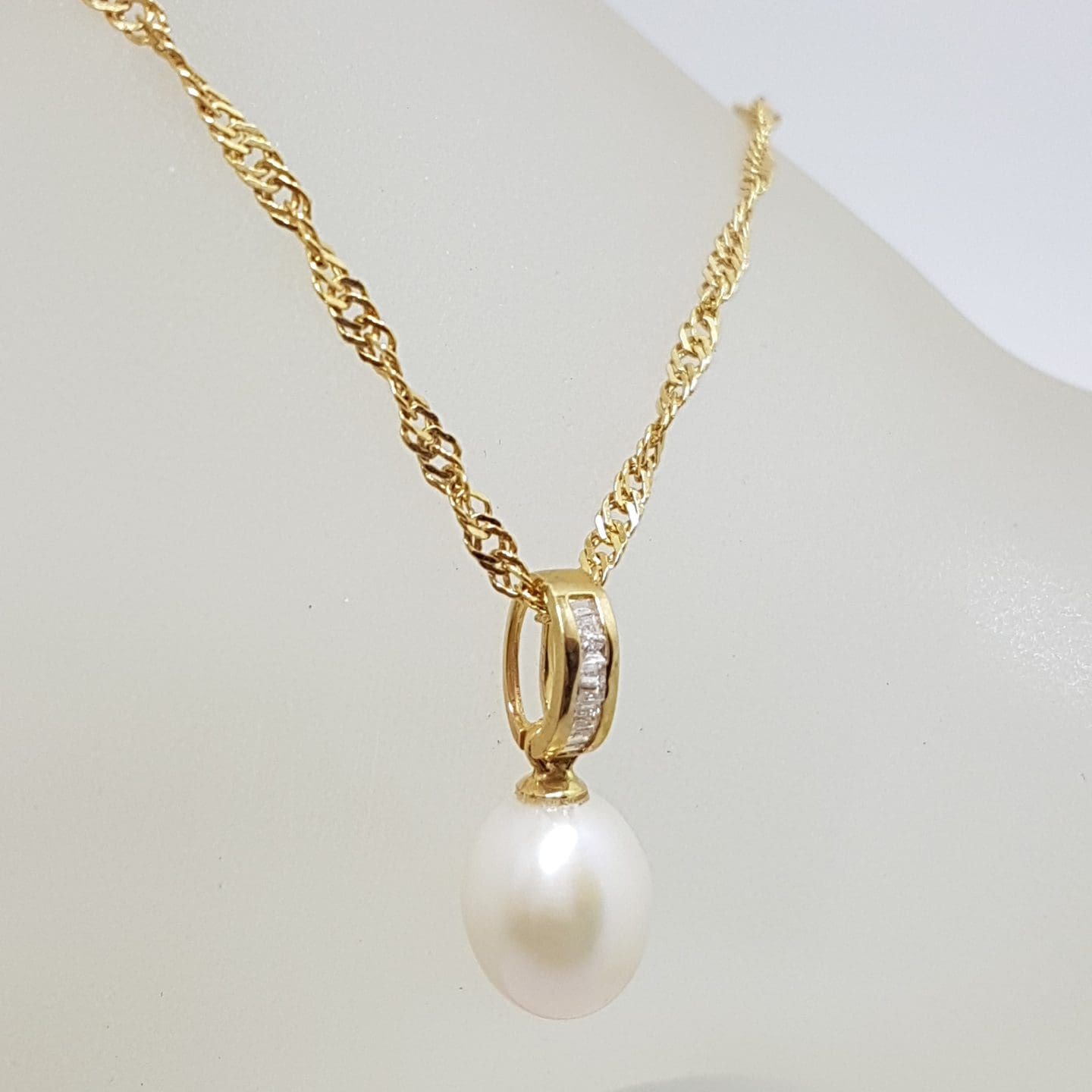7899ct Yellow Gold Pearl & Channel Set Diamond Pendant on Gold Chain