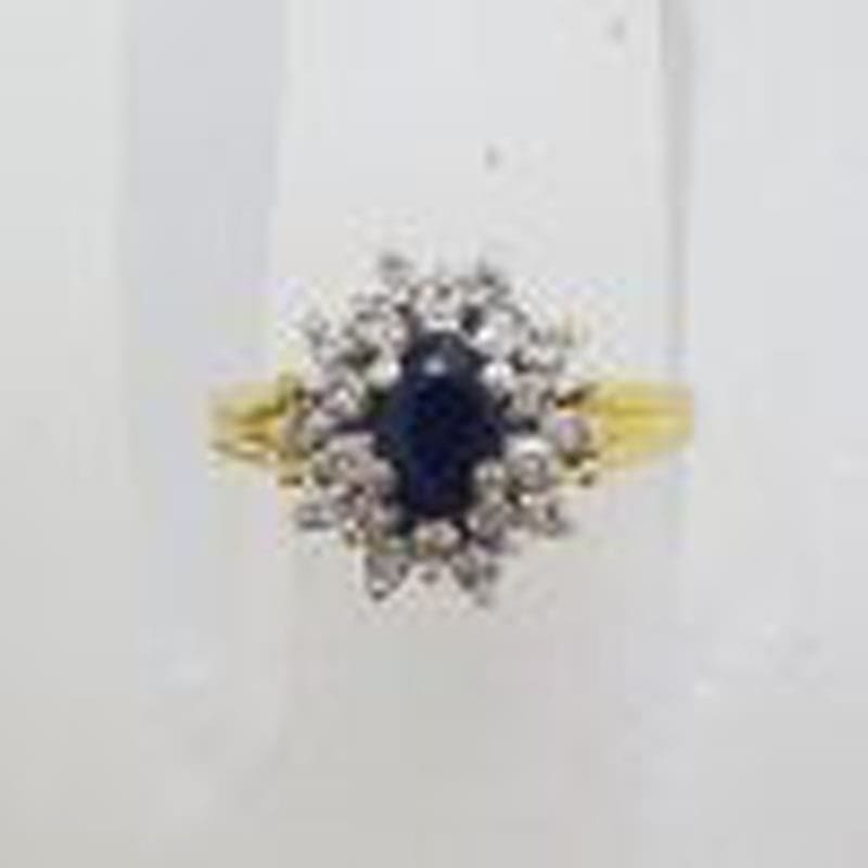 9ct Yellow Gold Oval Natural Sapphire surrounded by Diamond Cluster Ring