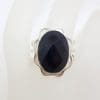 Sterling Silver Oval Onyx with Ornate Rim Ring - Faceted