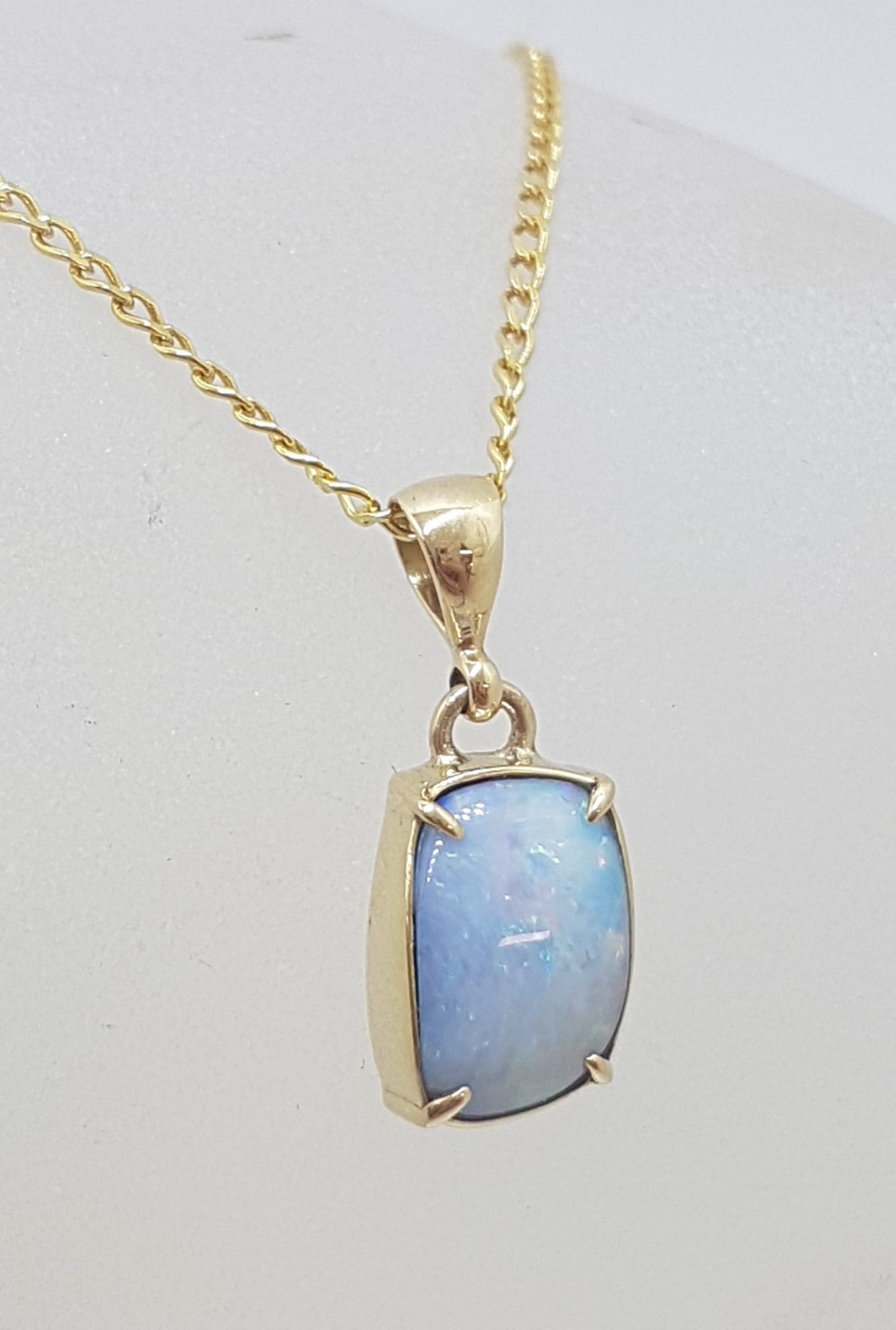 9ct Yellow Gold Rectangular Blue Opal Claw Set Pendant on Gold Chain