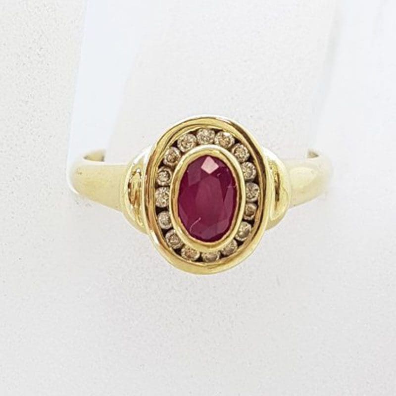 9ct Yellow Gold Oval Bezel Set Natural Ruby with Channel Set Diamond Cluster Ring