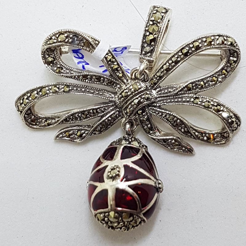 20210714_230138 Sterling Silver Marcasite and Red Enamel Egg Drop on Ornate Bow Enhancer Pendant / Brooch