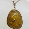 Sterling Silver Oval Natural Green Baltic Amber Pendant on Silver Chain