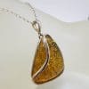 Sterling Silver Triangular Natural Green Baltic Amber with Wave Design Pendant on Silver Chain