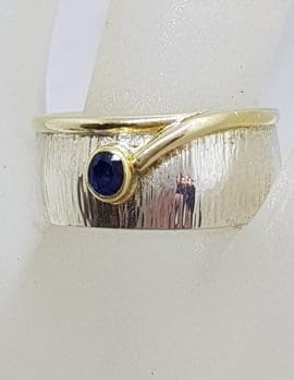 Sterling Silver and Plated Wide Patterned Band Ring with Oval Sapphire