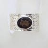 Sterling Silver Oval Faceted Bezel Set Smokey Quartz in Wide Patterned Ring