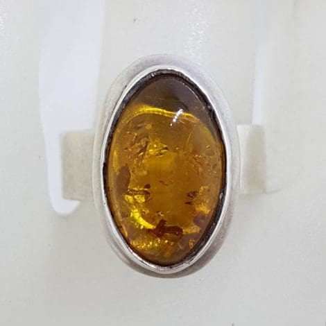 Sterling Silver Oval Bezel Set Amber Ring