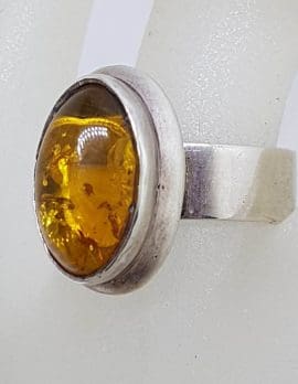 Sterling Silver Oval Bezel Set Amber Ring