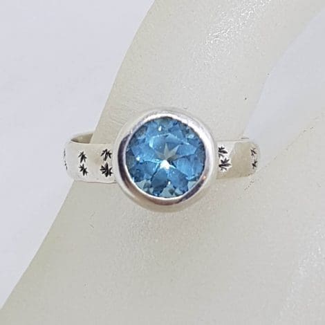 Sterling Silver Round Topaz in Bezel Setting with Patterned Band Ring