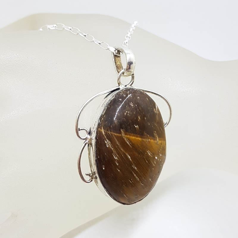 Sterling Silver Tiger Eye Large Oval Bezel Set Ornate Twist Pendant on Silver Chain Sterling Silver Tiger Eye Large Oval Bezel Set Ornate Twist Pendant on Silver Chain