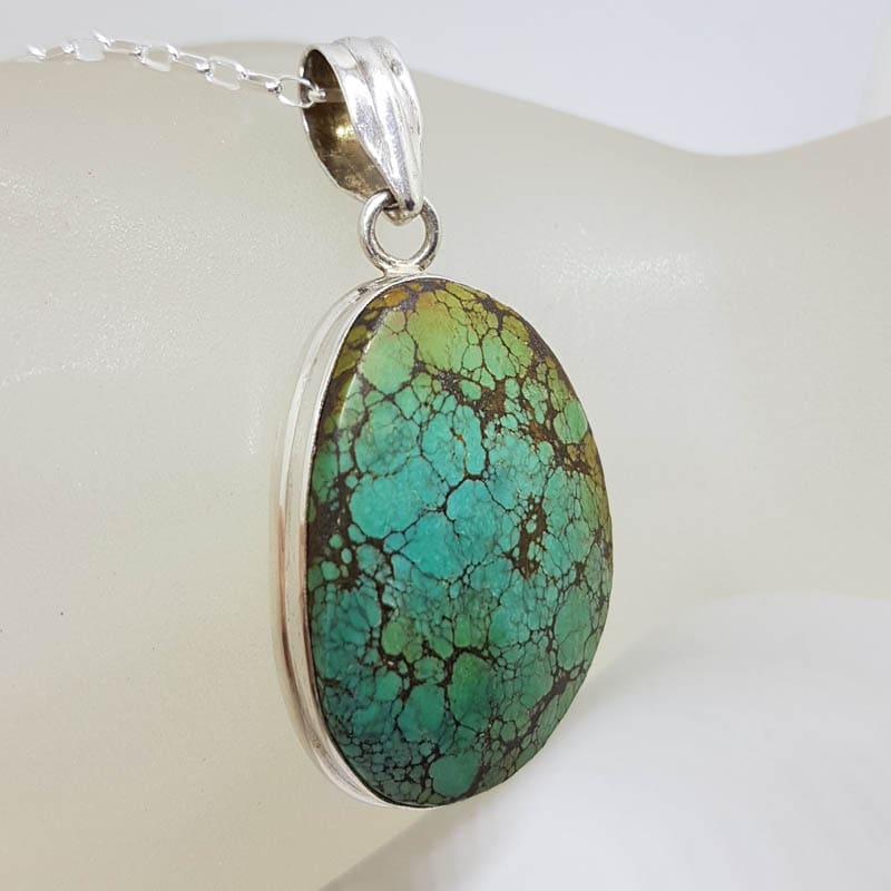 Sterling Silver Natural Turquoise Large Oval / Freeform Shape Pendant on Silver Chain Sterling Silver Natural Turquoise Large Oval / Freeform Shape Pendant on Silver Chain