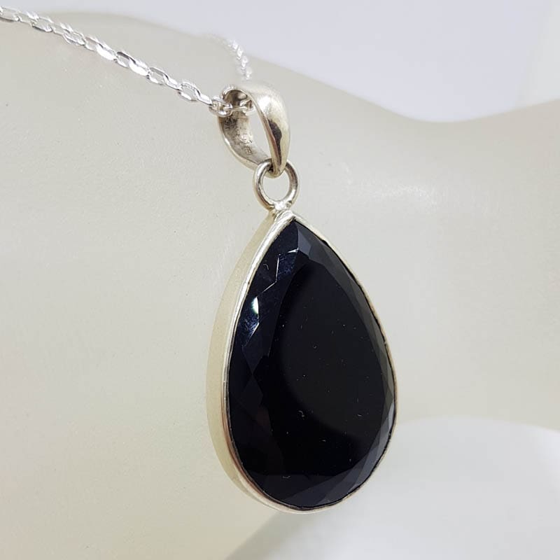 Sterling Silver Onyx Faceted Teardrop / Pear Shape Pendant on Silver Chain Sterling Silver Onyx Faceted Teardrop / Pear Shape Pendant on Silver Chain