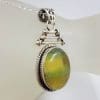 Sterling Silver Fluorite Oval with Hinged Ornate Top Pendant on Silver Chain