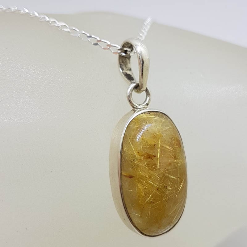 Sterling Silver Rutilated Quartz Oval Pendant on Silver Chain Sterling Silver Rutilated Quartz Oval Pendant on Silver Chain