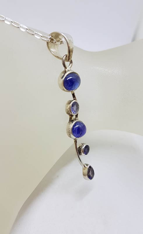 Sterling Silver Tanzanite Cabochon Cut and Faceted Long Twisted Pendant on Silver Chain