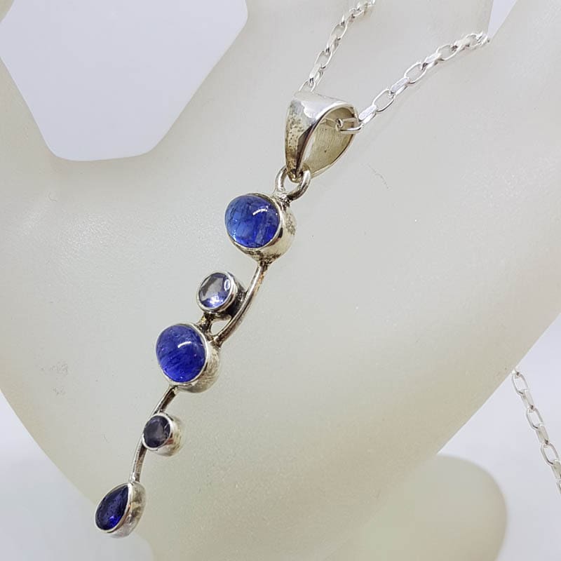 Sterling Silver Tanzanite Cabochon Cut and Faceted Long Twisted Pendant on Silver Chain