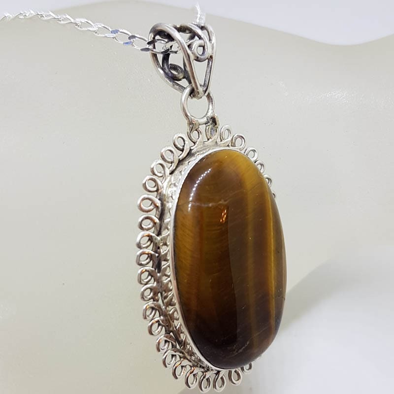 Sterling Silver Tiger Eye Cabochon Cut Oval Twist Rim Pendant on Silver Chain