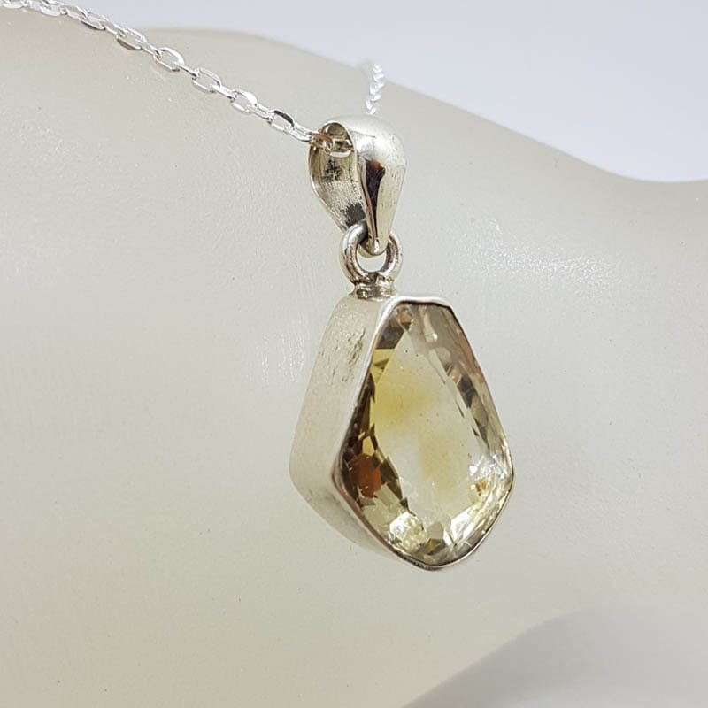 Sterling Silver Bezel Set Unusual Shape Citrine Pendant on Silver Chain Sterling Silver Bezel Set Unusual Shape Citrine Pendant on Silver Chain