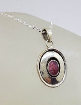 Sterling Silver Oval Rimmed Ruby Pendant on Silver Chain