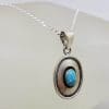 Sterling Silver Oval Rimmed Turquoise Pendant on Silver Chain
