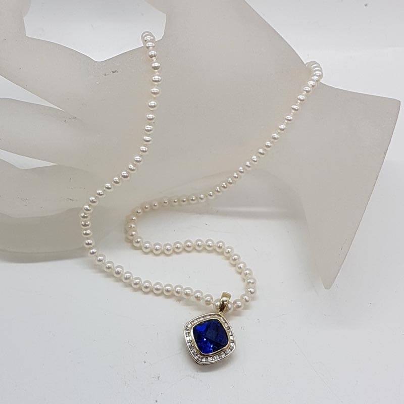 9ct Yellow Gold Square Created Blue Sapphire Surrounded by Diamonds Enhancer Pendant on Pearl Necklace / Chain 9ct Yellow Gold Square Created Blue Sapphire Surrounded by Diamonds Enhancer Pendant on Pearl Necklace / Chain