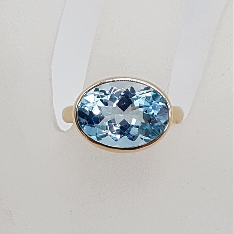 9ct Yellow Gold Topaz Blue Large / High Oval Bezel Set Ring