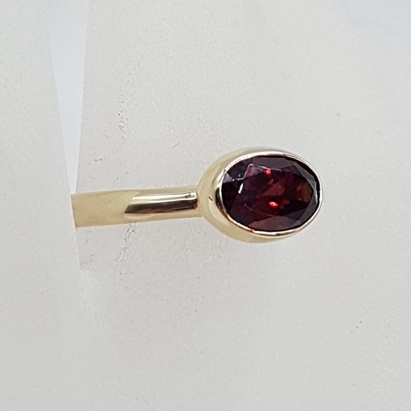 9ct Yellow Gold Garnet High Oval Bezel Set Ring 9ct Yellow Gold Garnet High Oval Bezel Set Ring