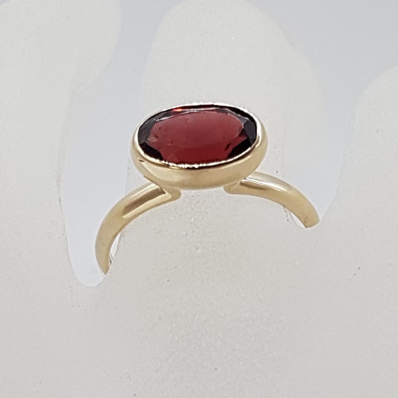 9ct Yellow Gold Garnet High Oval Bezel Set Ring 9ct Yellow Gold Garnet High Oval Bezel Set Ring