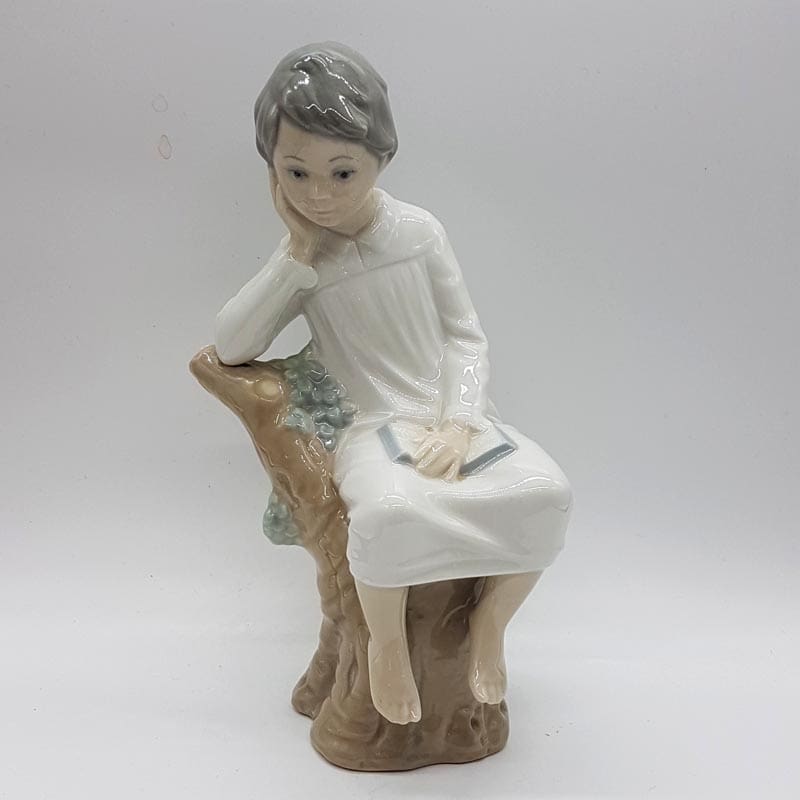 Lladro Thinking Boy Sitting on a Branch Figurine