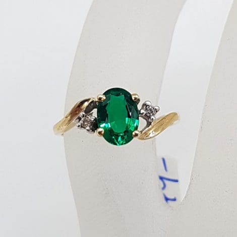 9ct Yellow Gold Oval Created Emerald with two Diamonds Ring