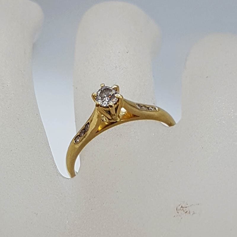 18ct Yellow Gold Diamond Claw Set High Solitaire Ring with Diamonds on the side - Engagement Ring