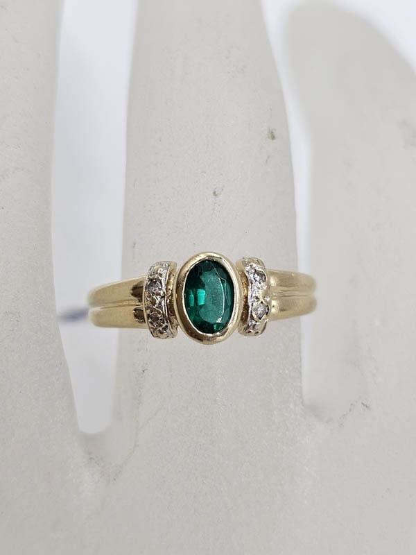 9ct Yellow Gold Created Emerald Oval with Diamond Bezel Set Ring
