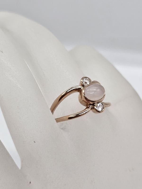 9ct Rose Gold Rose Quartz Cabochon Cut with 2 White Sapphires Open Design Ring 9ct Rose Gold Rose Quartz Cabochon Cut with 2 White Sapphires Open Design Ring