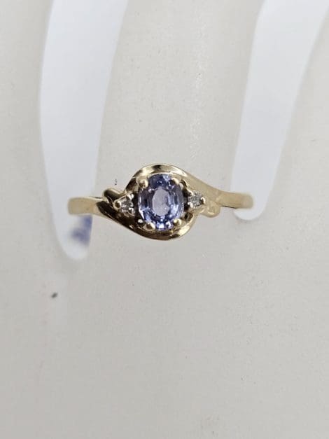 9ct Yellow Gold Oval Tanzanite and Diamond Twist Ring